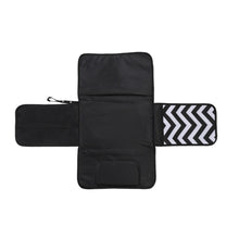 Black zigzag waterproof baby diaper changing pad unfolded for hygienic nappy changes on any surface.