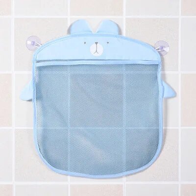 Blue bear mesh bath toy organizer bag mounted on a bathroom wall for tidy storage.