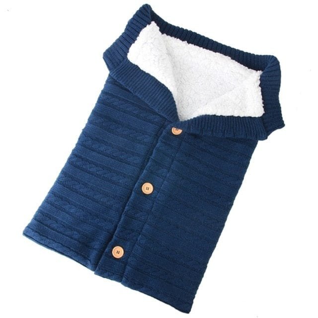 Blue lined newborn sleeping bag with a gentle-touch finish for comfortable, settled overnight sleep.