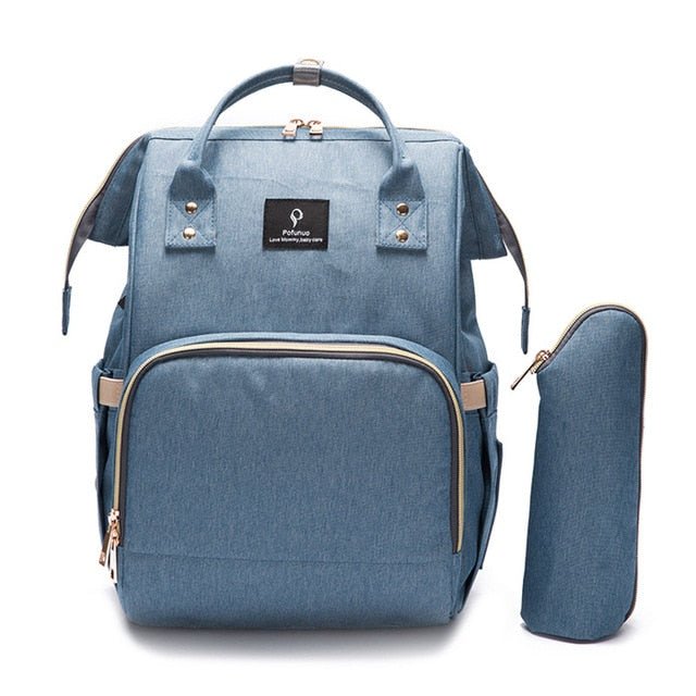 Modern Diaper Bag blue backpack with USB port for phone charging on the go.