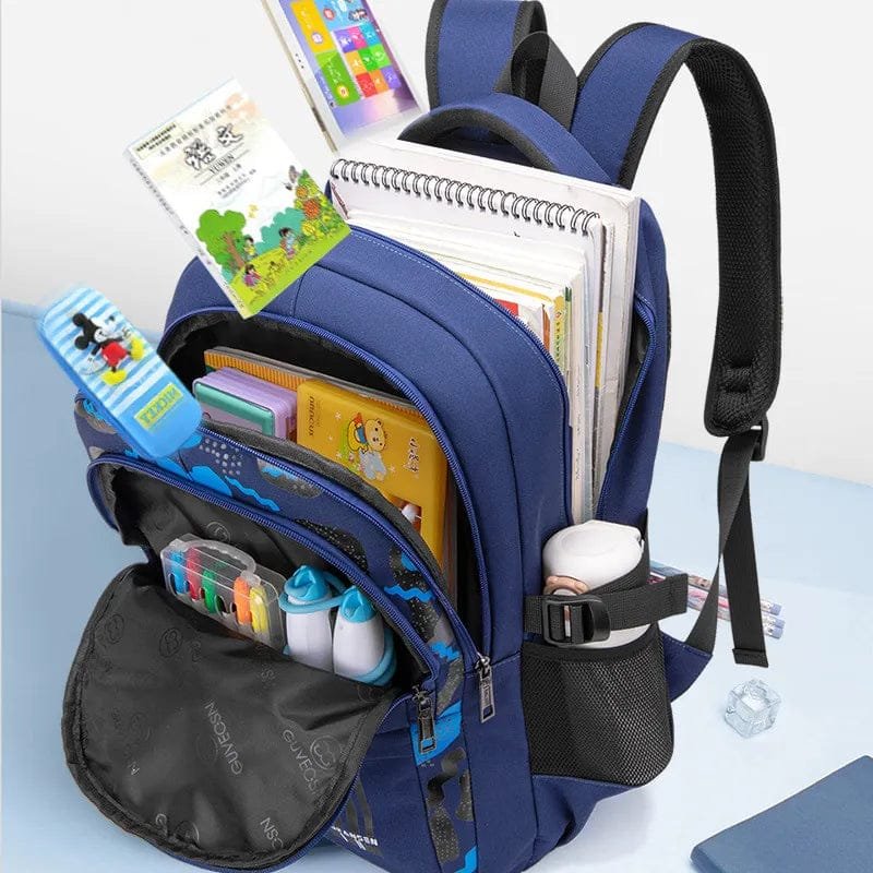 Blue orthopedic school bag packed with books and supplies, showing the space available for daily classroom needs.