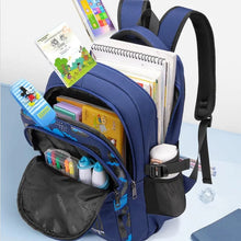 Blue orthopedic school bag packed with books and supplies, showing the space available for daily classroom needs.