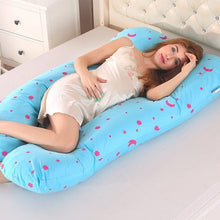 Blue and pink patterned U shaped pregnancy pillow as a comfort sleep cushion for expectant mothers.
