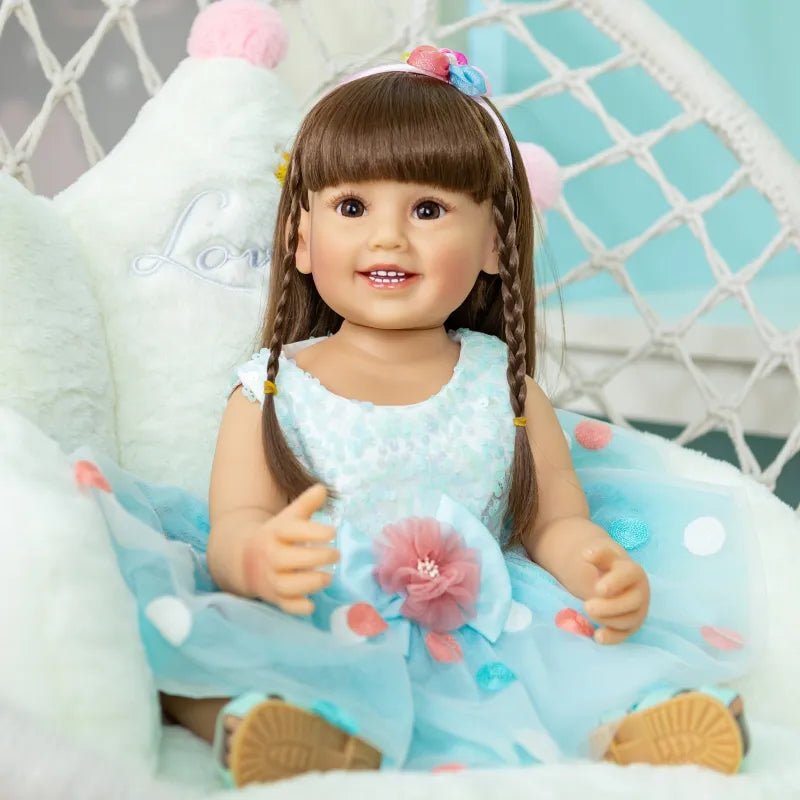 Blue skirt Reborn Toddler Doll with soft silicone body and floral detailing, a collectible fashion doll for gifting and display.