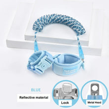 Blue toddler walking wrist link safety band with reflective trim for busy outdoor environments and shopping trips.