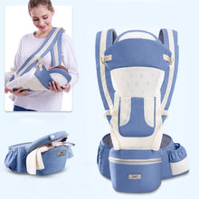 Blue and white hipseat baby carrier worn front facing for stroller-free outings and toddler carrying.