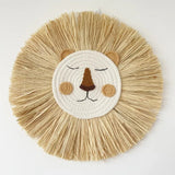 Round woven mat with a lion face design.