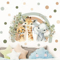 Children's room with animal-themed wall decal, pillows, and a cloud-shaped toy.