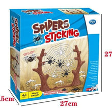Blue spider game box with a web and tree trunks and a 27 cm width mark on the front