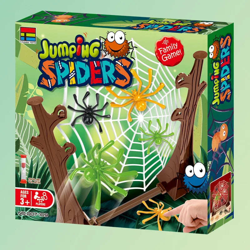 Spider game box showing a spider web on a tree-trunk frame with a finger pressing an orange spider
