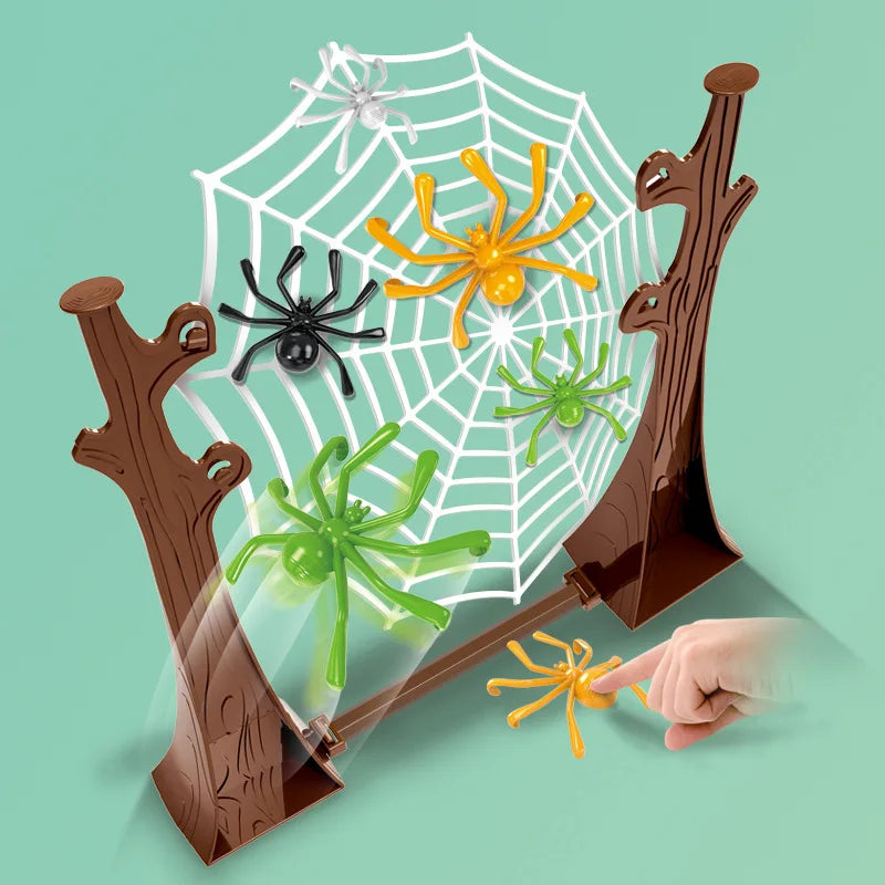 Tree-trunk frame with a white spider web, black, orange and green spiders and a finger pressing a spider