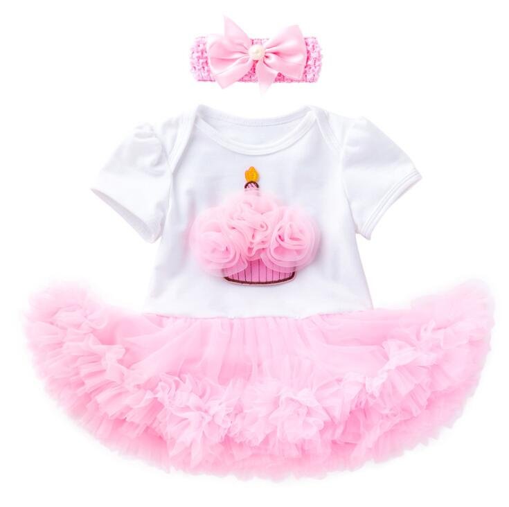 Baby outfit with white top, pink tutu skirt, and matching headband