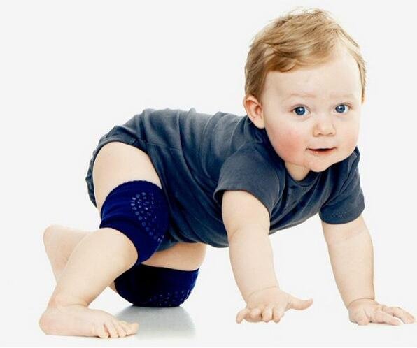 Breathable blue baby knee pad worn by a crawling baby for cool, comfortable knee protection during play.