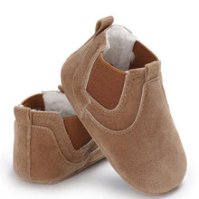 Pair of brown baby shoes with soft interior 
