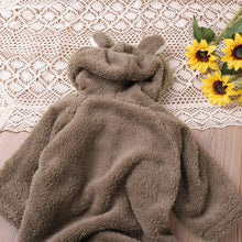 Brown cartoon baby romper styled flat lay for autumn dressing, gifting, and nursery photos.