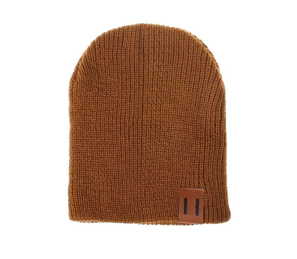 Brown crochet kids beanie hat flat lay for winter outfit planning and cold-weather baby dressing.