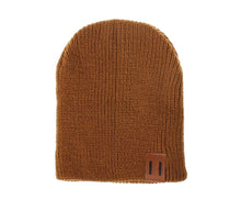 Brown crochet kids beanie hat flat lay for winter outfit planning and cold-weather baby dressing.