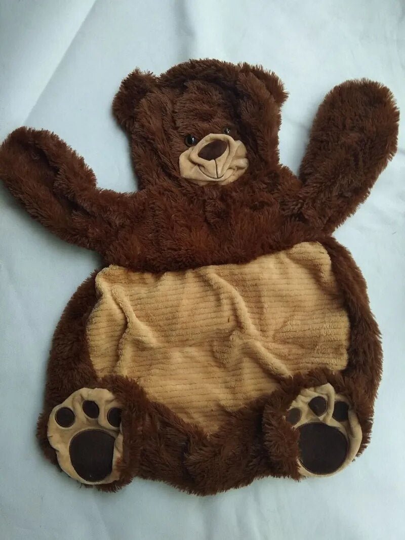 Brown teddy bear plush baby seat sofa with beige belly, a soft animal chair for baby sitting practice and nursery comfort.
