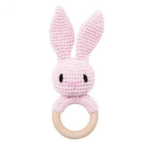 Bunny crochet baby rattle and teether wooden ring, a handmade toy for baby grasping, shaking, and gum relief.