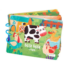 Colorful children's busy book with farm animal illustrations on a white background