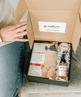 Person opening a box containing a product and a card with 'Sunflower' branding.