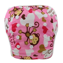 Pink diaper with monkey and heart pattern on a white background