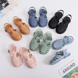 Set of colorful children's sandals on a light background