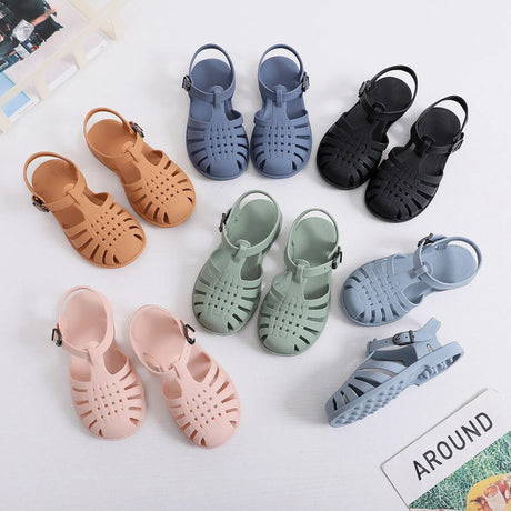 Set of colorful children's sandals on a light background