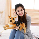 Woman holding a plush dog toy in a home setting