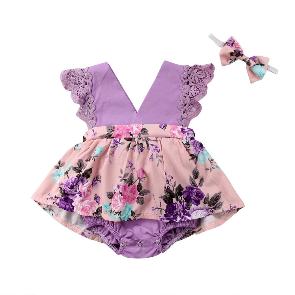 Baby romper with floral design and matching headband on a white background