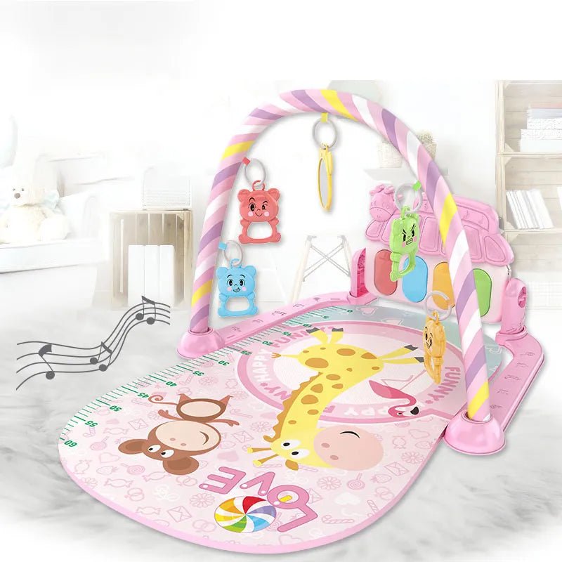 Pink baby play gym with toys and music notes on a white floor.