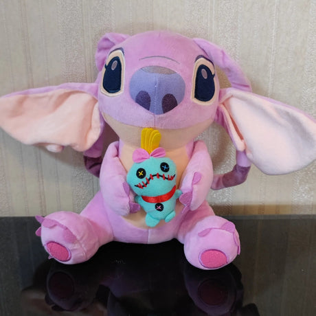 Plush toy with a character inside, sitting on a reflective surface with a neutral background