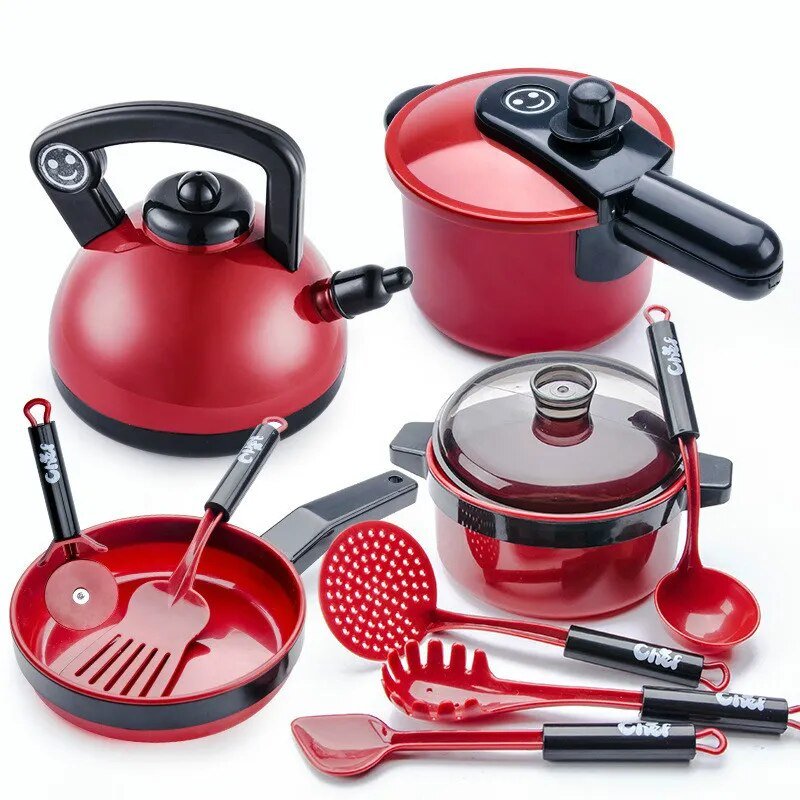 Red kitchen utensils set with pots, pans, and ladles on a white background