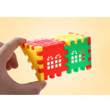 Colorful interlocking foam puzzle blocks held by a hand against a beige background