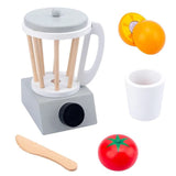 Toy blender set with fruits, vegetables, and utensils on a white background