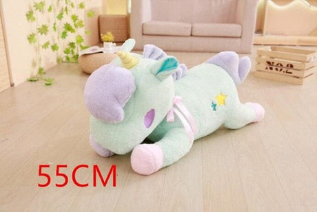 Plush toy dragon on a wooden floor with '55CM' text