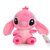 Pink plush toy with a tag on a white background