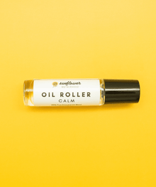 Calm essential oil roller bottle labeled for soothing aromatherapy use.