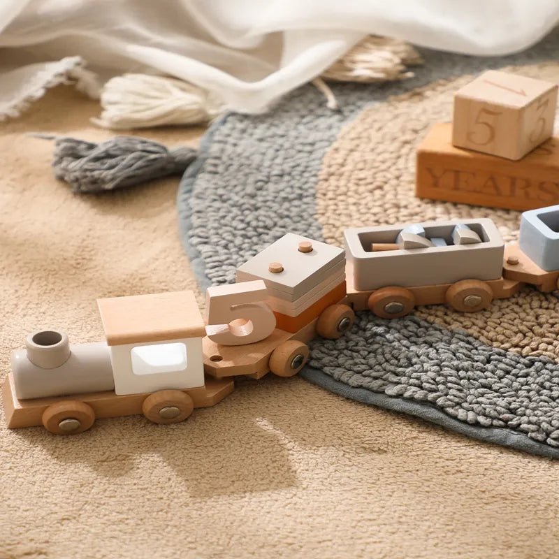 Classic Montessori wooden train and trolley toy set up on a carpeted floor for everyday indoor play.