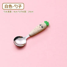 Carrot-shaped baby spoon with branding text shown for toddler tableware shopping.