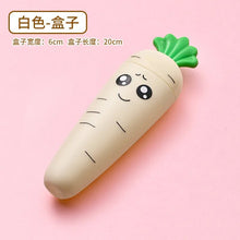 Carrot-shaped baby tableware container smiling face design shown from a side angle.