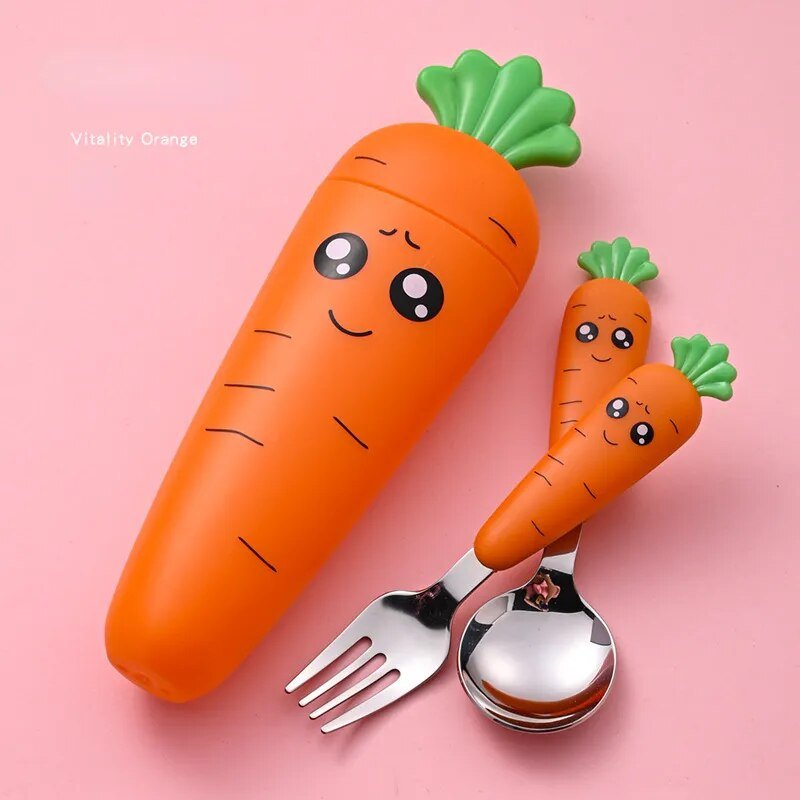 Carrot-shaped baby tableware container with utensils photographed at a different angle.