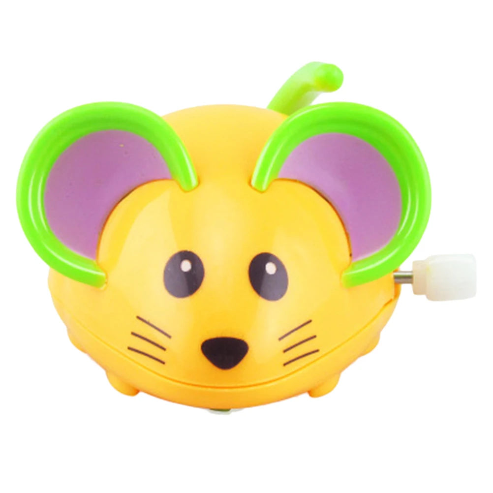 Front view of an orange cartoon mouse wind-up toy with green ears and a white wind-up key