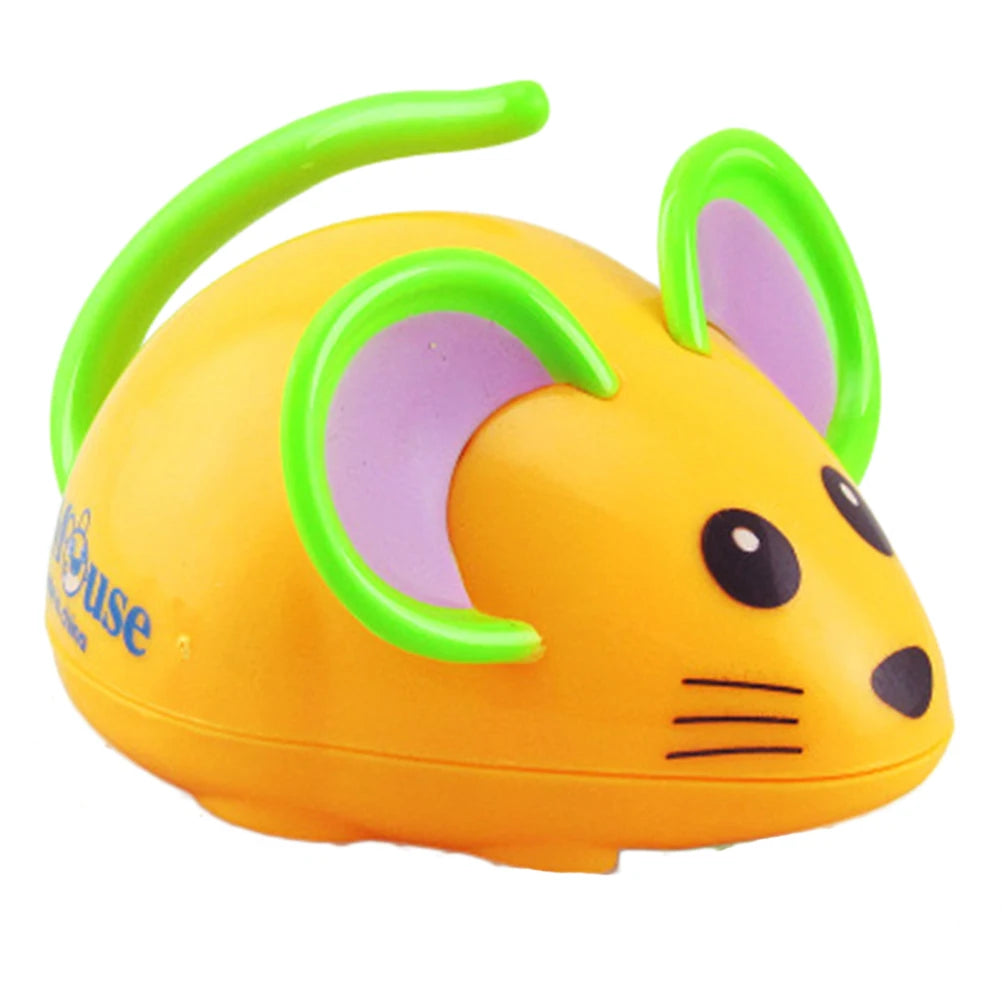 Side view of an orange cartoon mouse wind-up toy with green ears and a curved green tail