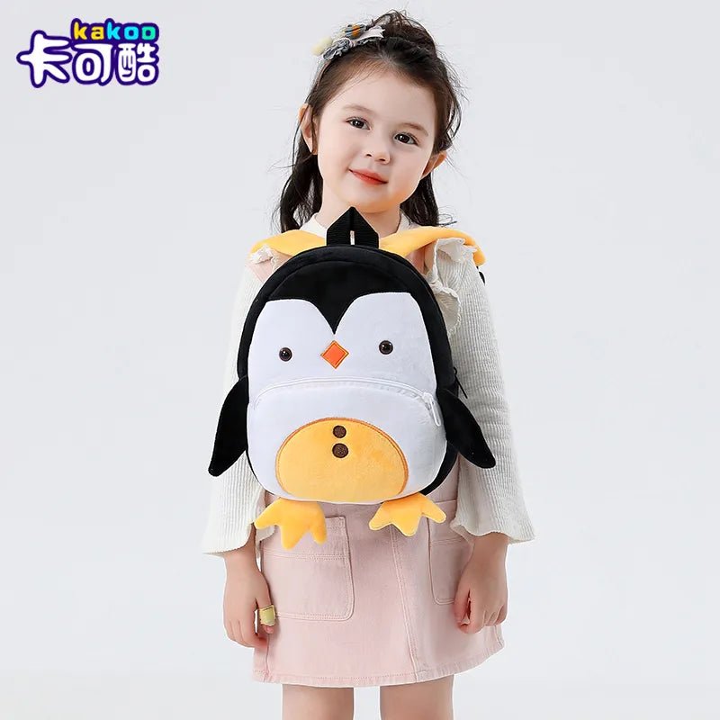 Cartoon Penguin Kids Backpack schoolbag worn by a child for daily school commutes and outings.