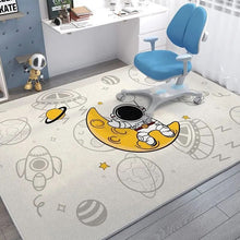 Children's room with a blue ergonomic chair on a space-themed rug.