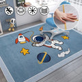 Children's room with a space-themed rug featuring an astronaut, rocket, and planets.