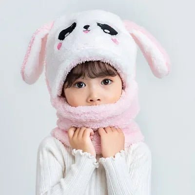 A child wearing a cute animal-themed hat and scarf.