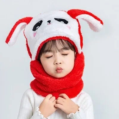 Child wearing a red and white bunny hat and scarf