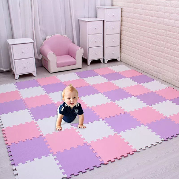 Toddler crawling on an EVA foam checkered puzzle play mat in a pink-furnished nursery for safe daily play.